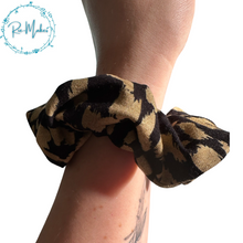 Load image into Gallery viewer, Black and gold animal print Scrunchie
